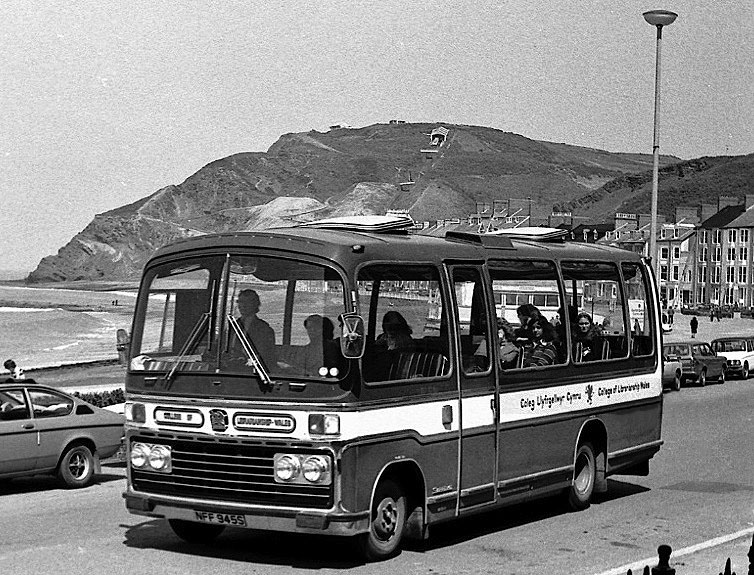 Black and white image of old bus from 1970s on Aberystwyth promenade